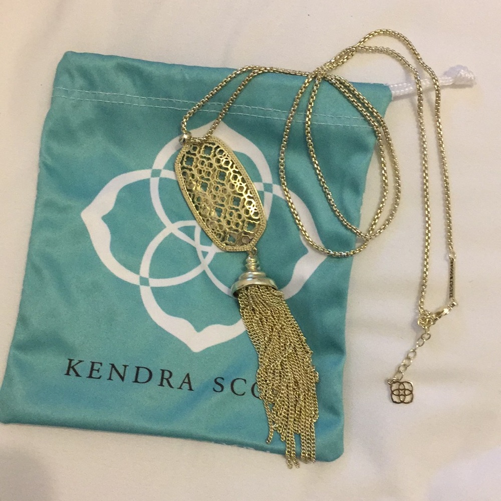 Long gold necklace, care bag included